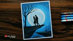 a couple is standing in the moonlight under a tree