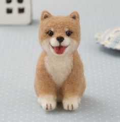 a small toy dog sitting on top of a table