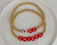 Kansas City Chiefs bracelets. Sold separately, but can be purchased as a set. Made with seed beads and gold accent beads. - - SIZING - - Every piece is made just for you! Our standard size fits a 6 inch wrist (measures 6.5 inches total length), but can be adjusted upon request. Please leave your desired size in the 'Notes' section upon checkout. Gold Heishi Beads Beaded Bracelets Gift, Gold Charm Bracelet With Colorful Beads For Friendship, Gift Stretch Bracelet With Gold And Heishi Beads, Gold And Heishi Beads Stretch Bracelet Gift, Gold Friendship Bracelets With Heishi Beads, Gold Heishi Beads Bracelets For Friendship, Gold Heishi Beads Bracelets As Gift, Gold Heishi Beads Bracelet Gift, Gold Name Bracelet With Colorful Beads For Friendship