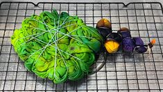 a bunch of vegetables sitting on top of a metal grate