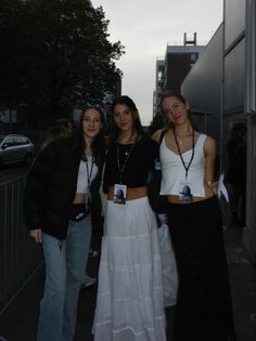 three young women standing next to each other