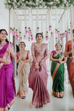 a group of women standing next to each other