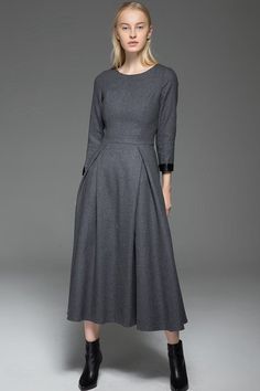 Exuding classic elegance with a contemporary twist. The classic long warm winter dress is impeccably tailored with beautiful pleats and darts for a body-slimming silhouette.  Perfect for smart casual styling, the warm wool dress is a versatile piece ideal for between-season as well as winter looks.  Impeccably handcrafted from soft wool, it falls below the knee so perfect to wear with long winter boots.  Pair yours effortlessly with a statement necklace and you're good to go!You may also like th Long Wool Dress, Winter Wool Dress, Warm Winter Dresses, Dark Clothing, Warm Dress, Plus Size Evening Gown, Dresses Australia, Mode Abaya, Gray Winter