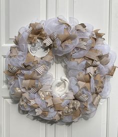 a wreath is hanging on the front door