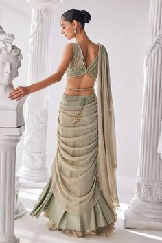 Jade green pre-draped saree in lycra and crinkle fabric. Paired with a corset blouse with sequin and bead work and a embroidered belt with tassels. - Aza Fashions Fitted Pre-draped Skirt For Festive Occasions, Draped Saree, Corset Blouse, Embroidered Belt, Crinkle Fabric, Drape Saree, Green Bead, Jade Green, Set For Women