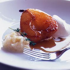 a white plate topped with mashed potatoes and an upside down pineapple on top