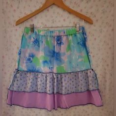 Floral Ruffled Skirt. Floral Cotton Top Tier, Blue Floral Gauze Middle Tier, Lilac Gauze Bottom Tier. Blue Overlocked Serged Contrast Stitching. Elastic Pull On Waist. Size Small. Machine Wash. Hardcore Bombshell Clothing Measurements Are Approximate 13.5" Across Waist 17" Across Hips 21" Long Please Don't Hesitate To Message Me With Any Questions And/Or Comments Prior To Buying. Thank You! #Cottagecore #Cottage #Fairy #Fairycore #Couqutte Mermaid Core, Cottagecore Cottage, Cottage Fairy, Garden Fairy, Skirt Floral, Ruffled Skirt, Fairy Core, Ruffle Skirt, Women Skirts Midi