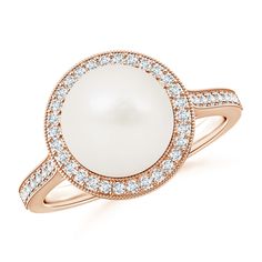 A Freshwater cultured pearl sits pretty amid a diamond halo. Several more diamonds adorn the shank and the gallery for extra sparkle. The milgrain detailing along the edges lends an exquisite appeal to this 14k rose gold pearl halo ring. Pearl Halo Ring, Pearl Halo, Cultured Pearl Ring, Rose Gold Pearl, Golden South Sea Pearls, Freshwater Pearl Ring, Pearl And Diamond Ring, Diamond Engagement Wedding Ring, June Birthstone Jewelry