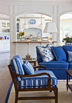 a living room with blue and white furniture