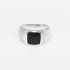 Fantastic Black Onyx Ring. The ring features an linear edged pattern around the square stone held in the centre, which is a Onyx Gemstone in a wonderful deep Shiny Black Color.     The ring shank is edged to show detail and looks lovely with the darkness of the onyx. Bit of a modern look with a Art Deco spirit. A great Ring for guys! ► DIMENSIONS: * Onyx stone size: 1.0 cm x 1.0 cm * Average silver weight: 5.4 gr. ► PRODUCTION METHOD:  💓 Handmade with Love and Care - Because it's better that wa Black Rectangular Stone Ring For Anniversary, Black Rectangular Anniversary Ring, Black Rings With Rectangular Stone For Anniversary, Black Rings With Polished Edges For Gifts, Black Rectangular Rings For Gifts, Rectangular Black Enamel Rings As Gift, Classic Black Rectangular Ring, Black Rectangular Signet Ring For Anniversary, Modern Black Ring With Rectangular Stone