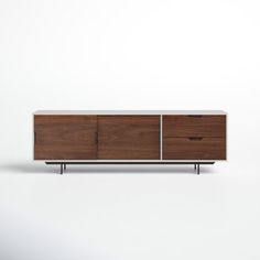 the sideboard is made from wood and has two drawers, one with metal handles