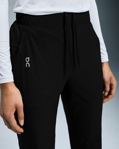 Lightweight and stretchy, these pants are dedicated to enhancing the joy of running. Made to move with you. Any direction. Any rhythm. The Core Pants move with you, thanks to an elastic waistband, gusset insert and pre-shaped knee construction. Plus, a hem that zips up to the knee makes changing into your gear a breeze. Engineered for 100% focus. No distractions. Just the run. A drawcord at the waist ensures a secure fit. And two side pockets mean you can keep essentials to hand. The lightweight Stretch Sports Joggers With Pull-on Style, Black 4-way Stretch Yoga Pants For Jogging, Functional Jogging Pants With Elastic Waistband, Elastic Waistband Full-length Workout Joggers, Full-length Joggers With Elastic Waistband For Workout, Full Length Joggers With Elastic Waistband For Workout, Stretch Yoga Pants With Elastic Waistband For Exercise, Athleisure Training Pants With Elastic Waistband, Functional Jogging Bottoms With Elastic Waistband