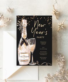 a new year's eve party card with champagne bottle and wine glass on it