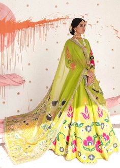 Raw Silk Parrot Green Lehenga Choli for Indian Bridal Wear is a trendy and stylish masterpiece that gives you the desired elegant appearance on a big day. The hand-crafted details of pearls, dabka, and sitara make this gorgeous Bridal Lehenga Choli your foremost priority for the wedding. Choli: Bridal Dhani green raw silk lehenga and choli have lovely Suzanne motifs in hot pink, navy blue, and white. It is enhanced with the magic of gota pati, dori, pearls, and naqshi. The perfect blend of black Parrot Green Lehenga, Ali Xeeshan, Green Lehenga Choli, Rajputi Dress, Wedding Lehenga Designs, Parrot Green, Lehenga Designs Simple, Green Lehenga, Pakistani Fashion Party Wear