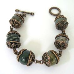 For Sale on 1stDibs - Fabulous 1990s Dweck Bracelet. There a total of 6 gemstones mounted in bronze tone over sterling silver, toggle clasp Hallmarked stephen dweck and Sterling Adjustable Brass Jewelry With Toggle Clasp, Vintage Brass Jewelry With Round Beads, Adjustable Antique Finish Jewelry For Jewelry Making, Adjustable Bronze Jewelry With Gemstone Beads, Vintage Metal Jewelry With Natural Stones, Vintage Bronze Beaded Bracelets, Bronze Brass Bracelets With Round Beads, Vintage Wire Wrapped Round Bead Jewelry, Vintage Wire Wrapped Bracelet