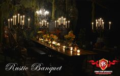 a long table with candles and flowers on it in front of a dark background that says rustic banquet