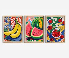 three pieces of artwork hanging on a wall next to each other with fruit and berries