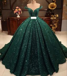 Elevate your formal look with this beautiful dark green wedding dress. Featuring dazzling sequin appliques and a spectacular ballgown silhouette, this elegant piece will make you look and feel like royalty on your special day. Make a statement with Hot Appliques Ball Gown Dark Green Sequin Quinceanera Dress! Green symbolizes balance and harmony, A green wedding dress is just as gorgeous as a white gown on a bride's wedding day. If you want to pack in the drama, while still feeling utterly elegan Dark Green Wedding Dress, Dark Green Quinceanera Dresses, Green Quince Dress, Green Wedding Dress, Green Quinceanera Dresses, Xv Dresses, Green Ball Gown