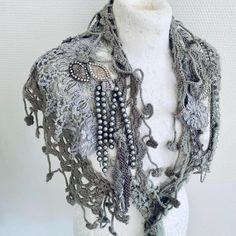 Handmade scarf made from knit and lace  collar in Grey  . Knit collar with beautiful lace scarf  It has a lovely texture , soft and warm . I have added jewellery and deco to give it a unique look of RawRags. This is a one of a kind item , ready made and can be send fast . Any questions please just ask and I will return as soon as possible . Bohemian Crochet Shawl For Winter, Bohemian Festival Hand Knitted Shawl, Bohemian Hand Knitted Shawl For Festival, Winter Bohemian Shawl With Crochet Lace, Bohemian Crochet Lace Shawl For Winter, Winter Bohemian Crochet Lace Shawl, Elegant Handmade Shawl As Gift, Elegant Handmade Shawl For Gift, Bohemian Crochet Lace Shawl