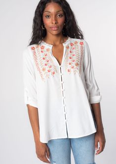 Looking for a Spring wardrobe refresh? This simple yet refined long sleeve bohemian blouse features a delicate self-covered button front, flattering split v-neckline, and floral embroidered detail. Wear it loose over denim, or try it tied in the front. Vintage floral embroidery Relaxed fit Long rolled sleeve with button tab closure Rounded hemline Side vents V-neckline Lace trim Self-covered button front Can be tied at the front Bohemian top Model is 5'9, wearing a size S.Style: I-13797W-RPX Spring Bohemian Blouse With Buttons, Bohemian Spring Blouse With Buttons, Bohemian Spring Tops With Buttons, Spring Bohemian Button-up Tops, Feminine Embroidered V-neck Blouse, Long Sleeve Embroidered Top For Spring Daywear, Bohemian Button-up Blouse For Vacation, Summer Blouse With Split Neck And Buttons, Bohemian Blouse With Button Closure For Vacation