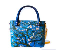 A unique handmade leather bag - Vincent van Gogh "Branch of Almond Blossom", in applique technique.  - The bag is made of high quality Italian leather, soft and pleasant to touch, but it keeps its shape well. - Made in Italy. Impeccable craftsmanship and exquisite design. As you may have noticed, this is not just a bag, it is a WORK OF ART!  - The image on the bag is not just a flat painting; it is made in the APPLIQUE TECHNIQUE, which creates depth and three-dimensionality.  This bag features t Artisan Blue Bag For Gift, Artisan Rectangular Shoulder Bag Hand Painted, Artistic Bags For Everyday Use In Spring, Artisan Hand Painted Bags For Gifts, Artistic Blue Shoulder Bag For Daily Use, Artistic Blue Shoulder Bag For Everyday Use, Artisan Hand Painted Rectangular Shoulder Bag, Blue Hand Painted Bag For Gift, Artistic Hand Painted Satchel Shoulder Bag