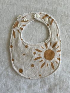 These bibs are handmade with a 100% cotton fabric front (120GSM) and a natural white coloured organic bamboo terry toweling backing (415GSM). The terry is double sided which gives extra absorbency. The bib is suitable for newborn to 3yrs as it features an adjustable neckline with three KAM snaps creating a snug comfortable fit around your little ones neck.  The bib is 24cm x 18cm (13cm from neck to bottom)  CARE Machine wash in cold or warm water and line dry flat in the shade as sun can damage Playful White Machine Washable Bib, Playful Cotton Bib, Machine Washable, Playful Cotton Bib Machine Washable, Playful White Cotton Bib, White Machine Washable Bib As A Gift, White Machine Washable Bib For Gift, White Machine Washable Bib As Gift, White Reusable Bib For Playtime, White Cotton Washable Bib