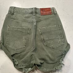 One Teaspoon Olive Green Shorts. Size 25. Like Brand New Trendy Khaki Short Bottoms, Casual Khaki Jean Shorts, Casual High Rise Khaki Shorts, Trendy Relaxed Fit Khaki Shorts, Green Cutoff Bottoms With Pockets, Casual Distressed High-waisted Shorts, Casual Green Cutoff Shorts, Trendy Green Distressed Bottoms, Green Cutoff Shorts With Pockets