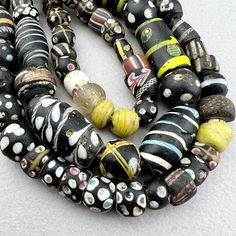 "A strand of various Venetian beads traded to Africa in the late 19th to early 20th century. A good variety of interesting beads in excellent to good condition. Assorted eye beads with a very nice Lewis and Clark bead. A few are chipped or cracked but most are very nice.  Nowadays the pickings are slim in Africa and the strands come with lots of fillers and many with condition issues.  \"As found\" in the marketplace in Upper Volta Over 50 years ago. 75 beads 27\" strand 61cm 6-12mm diameter .8 Antique Round Spacer Beads, Antique Oval Beads, Antique Multicolor Beaded Necklaces, Antique Hand-strung Oval Beads, Antique Multicolor Beaded Necklaces With Round Beads, Hand-strung Antique Oval Beads, African Trade Beads, Stone Wrapping, Lewis And Clark