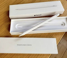 an apple pencil in its box on a table