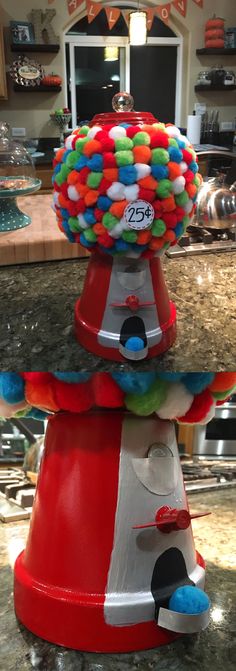 a red and white machine sitting on top of a counter next to a bowl filled with candy