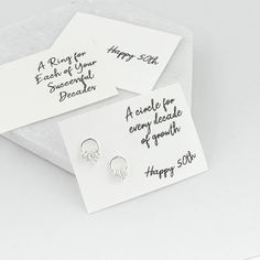 Sterling silver circle earrings displaying five circles, boxed with a message of your choice. These sweet 50th birthday earrings make a fantastic gift for anyone but are especially apt for those celebrating a 50th birthday. Each ring symbolises a decade and there are 4 small and 1 bigger ring all hanging on a circle stud earring. They come with a choice of gift cards or can sit against a velvet backdrop. Placed in a gift box they are ready to be passed on as a gift and you can choose to also hav Personalized Sterling Silver Earrings For Birthday, Silver Jewelry With Message Card For Birthday, Personalized Silver Earrings For Birthday, Nickel-free Earrings For Birthday, Personalized Silver Earrings For Birthday Gift, Velvet Backdrop, Birthday Earrings, Silver Circle Earrings, Compact Mirror Personalized