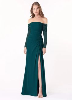 a woman in a long green dress with an off the shoulder top and side slit