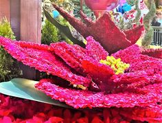 a large flower arrangement in front of a building