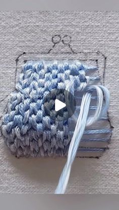 the video shows how to make a crochet bag with yarn and cottons