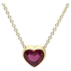 This gorgeous heart-shaped pink rubellite tourmaline necklace is simply dazzling! It features a 1.99 carat striking gem with vivid hot pink color, set in a custom-made 18k yellow gold bezel and suspended on a classic and elegant 18k yellow gold chain. The pendant measures approximately 3/8" in diameter, and the necklace can be adjusted from 16.5 to 18 inches for wonderful versatility! Stunning for both daytime and evening wear. What better way to show your affection than with this timeless expre Elegant Heart Cut Ruby Necklaces, Formal Ruby Heart Cut Necklace, Formal Heart Cut Ruby Necklaces, Formal Heart Shaped Gemstone Necklace, Formal Heart Cut Ruby Necklace, Formal Heart-shaped Gemstone Necklace, Formal Pink Heart Cut Necklace, Ruby Heart Cut Gemstone Necklace, Heart Cut Ruby Gemstone Necklace