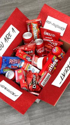 a red box filled with lots of candy