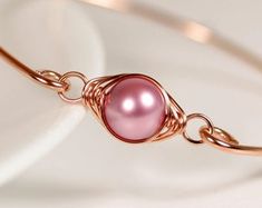 Items similar to White Pearl Bangle Bracelet Wire Wrapped Jewelry Handmade Sterling Silver or Gold Bracelet Bridal Pearl Bracelet Swarovski Pearl Jewelry on Etsy Rose Gold Wire Wrapped Bracelet, Wire Wrapped Rose Gold Bracelet, Elegant Pink Gold Metal Bracelets, Elegant Pink Gold Bangle As Gift, Elegant Pink Gold Metal Bracelet, Adjustable Rose Gold Wire Wrapped Bracelets, Elegant Pink Wire Wrapped Bracelets, Pink Gold Metal Bracelet, Rose Gold Bangle Bracelets For Jewelry Making