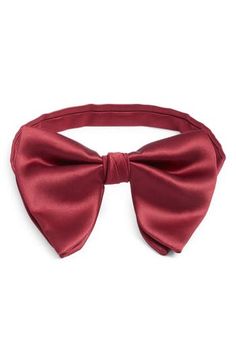 Smart and simple, this bow tie crafted from jewel-tone silk comes pre-tied with a small knot that emphasizes its classic shape. Pre-tied; adjustable 100% silk Spot clean Made in the USA of imported fabric Classic Pre-tied Butterfly Knot Bow Tie, Solid Color Standard Tie Satin Bow, Elegant Solid Color Bow With Tie Back, Elegant Solid Color Bow For Wedding, Elegant Red Bow For Gift, Solid Color Bow Tie For Party, Elegant Solid Bow Tie, Elegant Solid Color Bow, Classic Pre-tied Bow Tie With Butterfly Knot