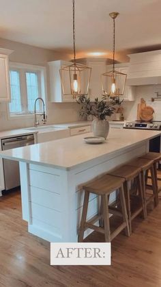 an image of a kitchen with white cabinets and wood stools on the countertop