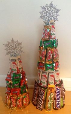 two christmas trees made out of candy bars