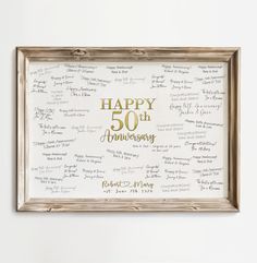 a 50th wedding anniversary sign in gold and white with the words happy 50th anniversary written on it