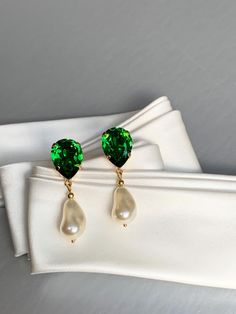 Elegant teardrop earrings featuring dark moss green tops paired with ivory crystal baroque dangles. Made with Premium Quality European Crystal. Available in gold, rose gold or silver finish. Post back.  - Measurements :    1 5/8" long from the top to the bottom of the earring    1/2" wide * RETURN POLICY - We do not accept returns for a refund as all of out items     are made to order. But please contact us if you are     having an issue with your order. - We do accept exchanges. You can exchang Green Pearl Dangle Earrings, Green Dangle Pearl Earrings, Elegant Green Pearl Charm Earrings, Elegant Green Pearl Earrings With Charm, Green Pearl Earrings For Wedding, Green Drop Pearl Earrings For Wedding, Elegant Green Pearl Earrings For May Birthstone, Green Pearl Drop Earrings For Formal Occasions, Green Teardrop Pearl Earrings For Wedding