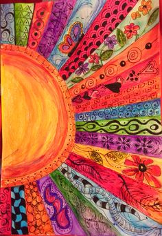 an art project made with colored paper and watercolor pencils, depicting the sun