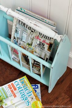 a magazine rack with magazines in it on the floor