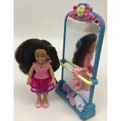 a doll is standing in front of a mirror