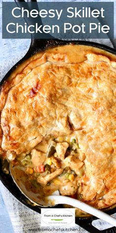 a chicken pot pie in a cast iron skillet with text overlay that reads cheesy skillet chicken pot pie