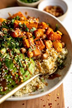 a white bowl filled with rice and vegetables