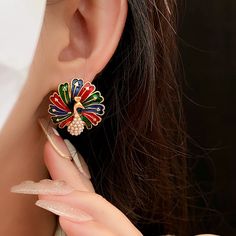 ✦ Looking to celebrate and throw a party? Our fantastic color peacock stud earrings are sure to make a statement. Peacocks symbolize mystery and pride, and these earrings capture that essence perfectly. When you adorn yourself with these peacock earrings, you become a captivating presence, catching everyone's attention in an instant. ----------- DESCRIPTIONS ----------- - SKU: WE120- Materials: Copper, 925 Sterling Silver, Enamel, Faux Pearl- Pendant Size(Length* Width): 2.5cm*2.5cm Gothic Minimalist, Color Peacock, Peacock Earrings, Elegant Gothic, Crystal Hoop Earrings, Nose Rings Hoop, Throw A Party, Classic Elegant, Peacocks