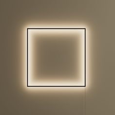 an illuminated square in the middle of a room