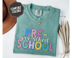 Showcase your dedication and care with Pre-school Teacher Comfort Colors shirt, perfect for staying cozy and professional. Wear to celebrate the first or last day of school, or to show your career pride in style year round!  About - Comfort Colors 1717 Crewneck Tshirts - 100% Ring-Spun Cotton - Relaxed Fit, Unisex Sizing - Direct to Garment (DTG) Printed - Ink is printed directly onto the item which results in a long lasting, slightly distressed look.  Care - For best care, we recommend apparel Green Long Sleeve School T-shirt, Green Long Sleeve T-shirt For School, Green School Spirit Tops For School, Green Pre-shrunk Tops For School, Green Letter Print T-shirt For End Of School Year, End Of School Year Long Sleeve T-shirt, Customizable Casual T-shirt For Back To School, Long Sleeve T-shirt For End Of School Year, Long Sleeve School Spirit T-shirt